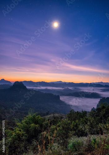 Viewpoint mist mountain colorful with the moon at dawn