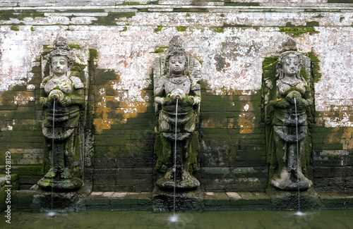 Ancient sculptures at Goa Gajah temple built at the 9th century, photo