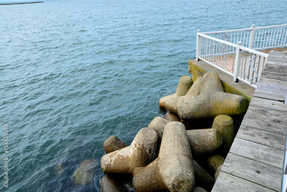 Concrete shapes used as sea wall defense from wave action Concrete shapes used as sea wall defense from wave action