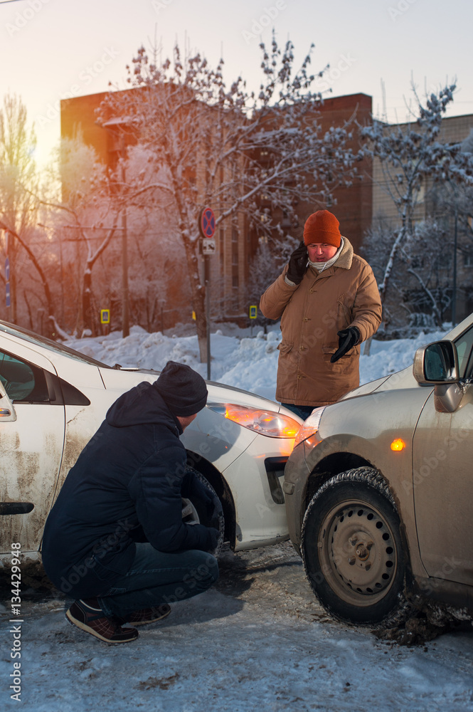 Man calling to car assistance after crash