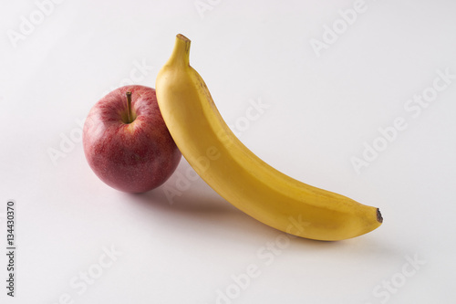 Fresh fruits: banana, apple on white background