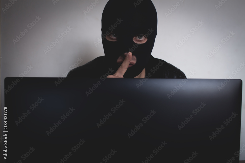 Hacker with computer. Hacker with computer.