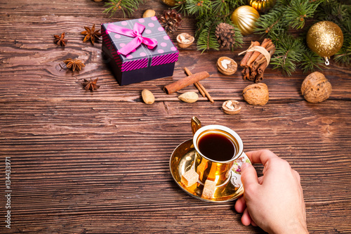 little coffe cup and gift on a christmas decorations photo