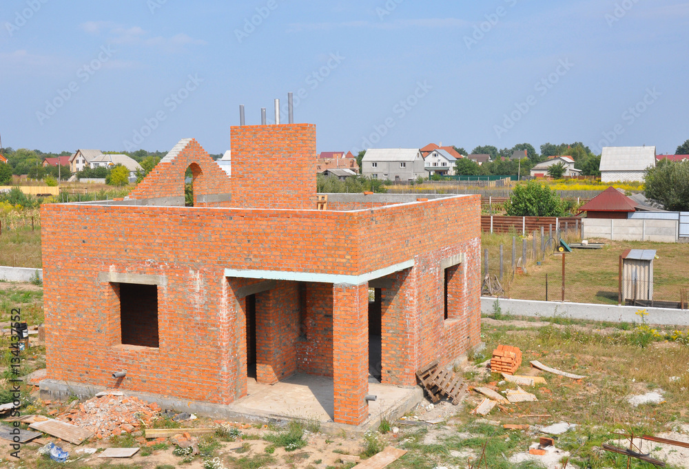 Brick House construction site. Building construction brick house. Unfinished Home Construction.