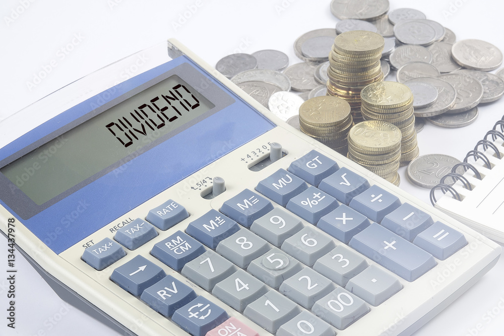 Coins and calculator with business and finance conceptual text. Coins and calculator with business and finance conceptual text.