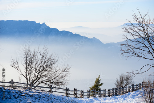 beautiful french alps winter panoramic aerial view landscape with a fantastic blue haze cloudy mountain background © W PRODUCTION