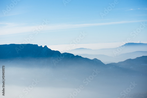 beautiful french alps winter panoramic aerial view landscape with a fantastic blue haze cloudy mountain background
