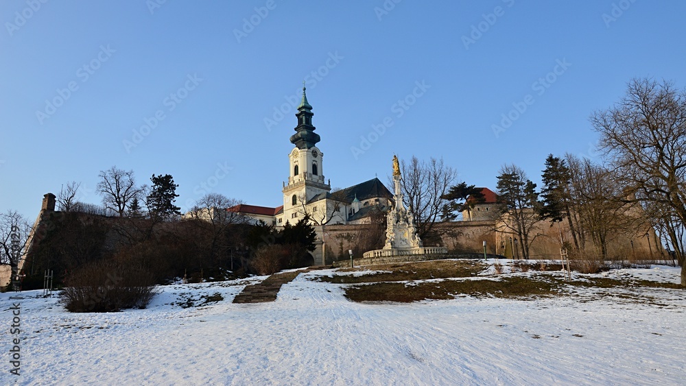Panorama view of Nitra castle in Slovakia with visible St. Emmeram Cathedral tower during winter season
