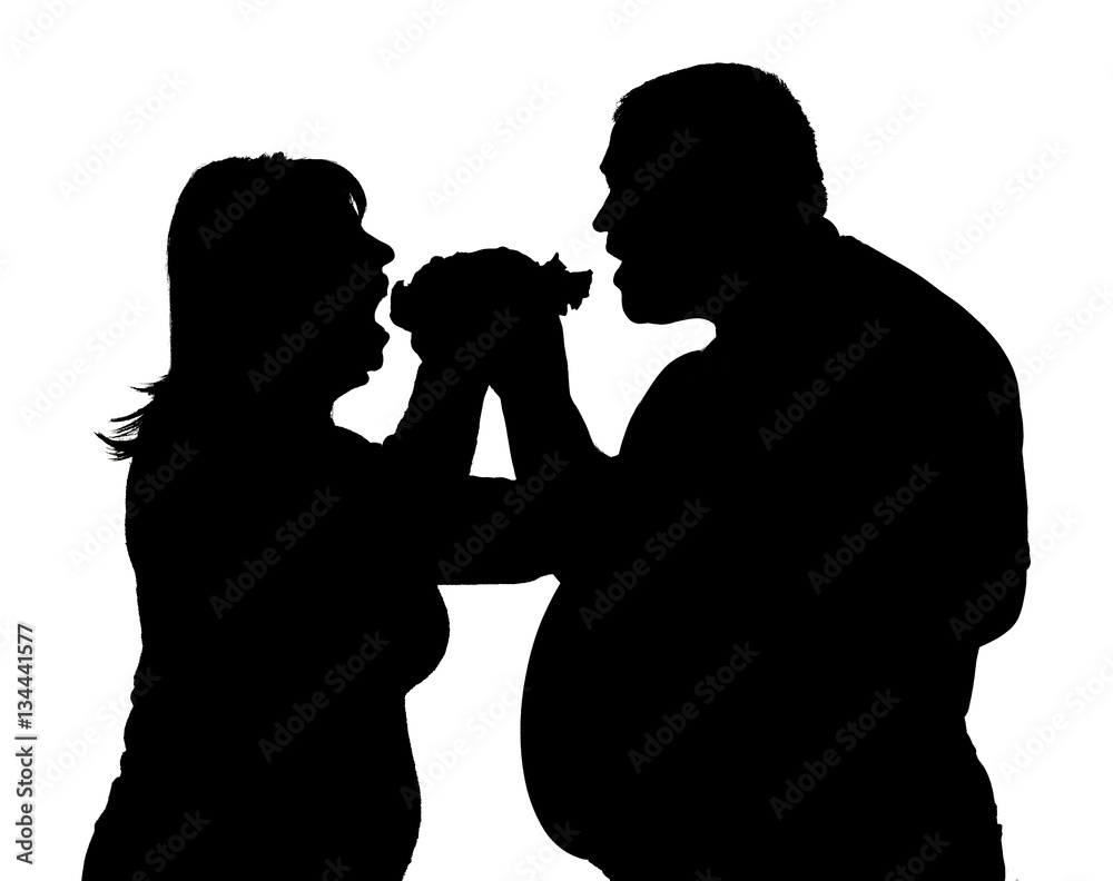 silhouette of a man and woman fighting for hamburger