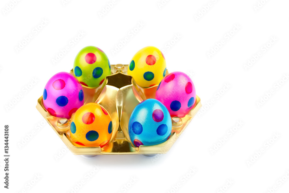 Several painted easter eggs in gold tray