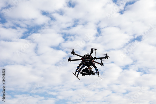 Fototapeta Naklejka Na Ścianę i Meble -  Drone flying on the sky background