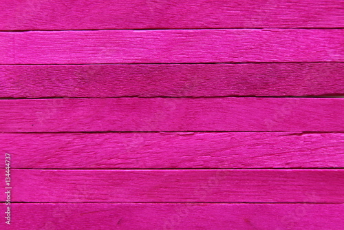 Pink wooden background.