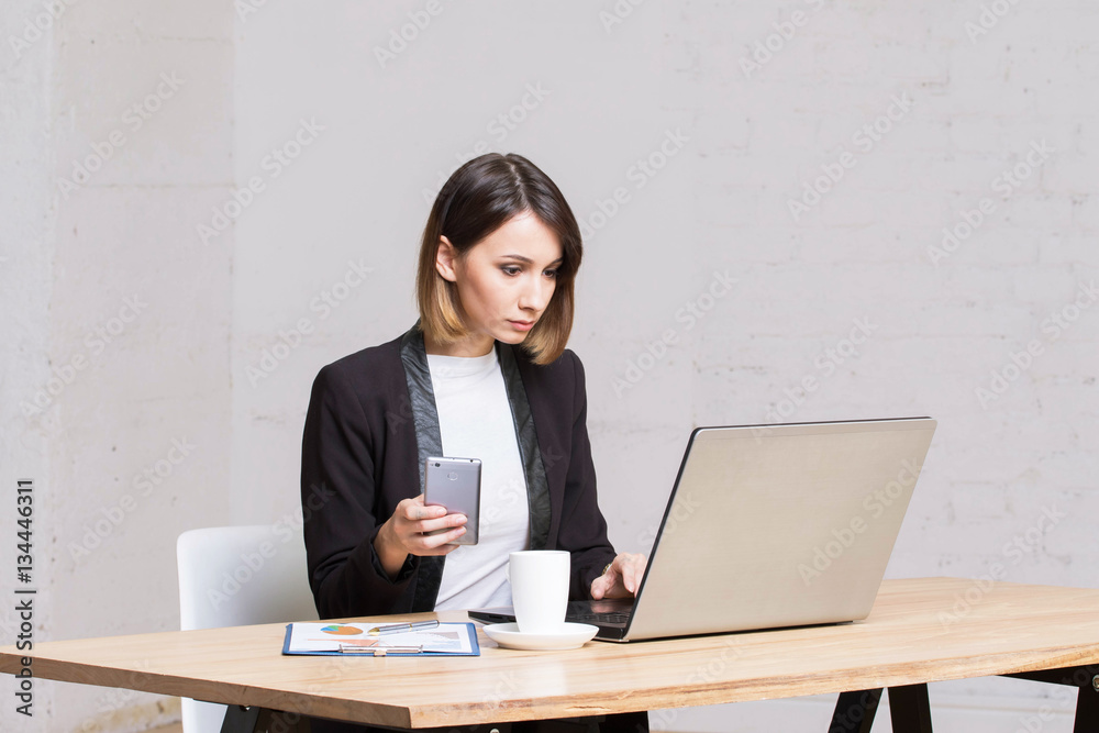 Business woman answers the office smartphone call work. Business woman answers the office smartphone call work.