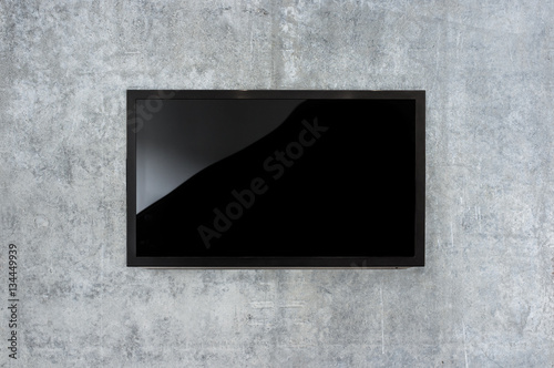 Black LED tv television mockup, blank on gray concrete background