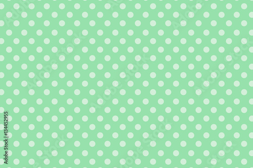 white polka dots on green background