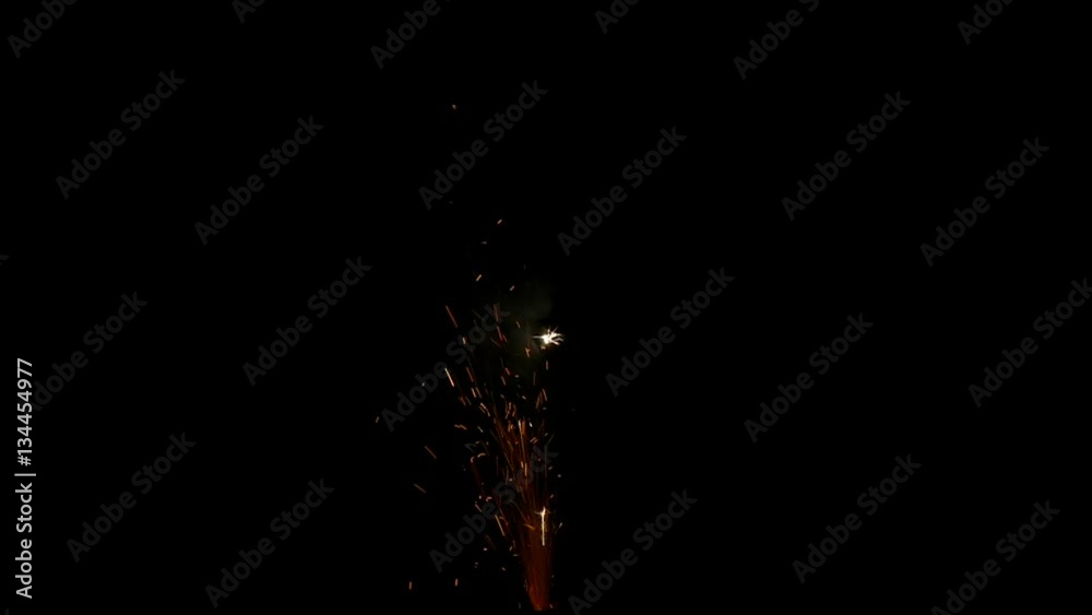 Firework sparkle isolated on a black background in slow motion