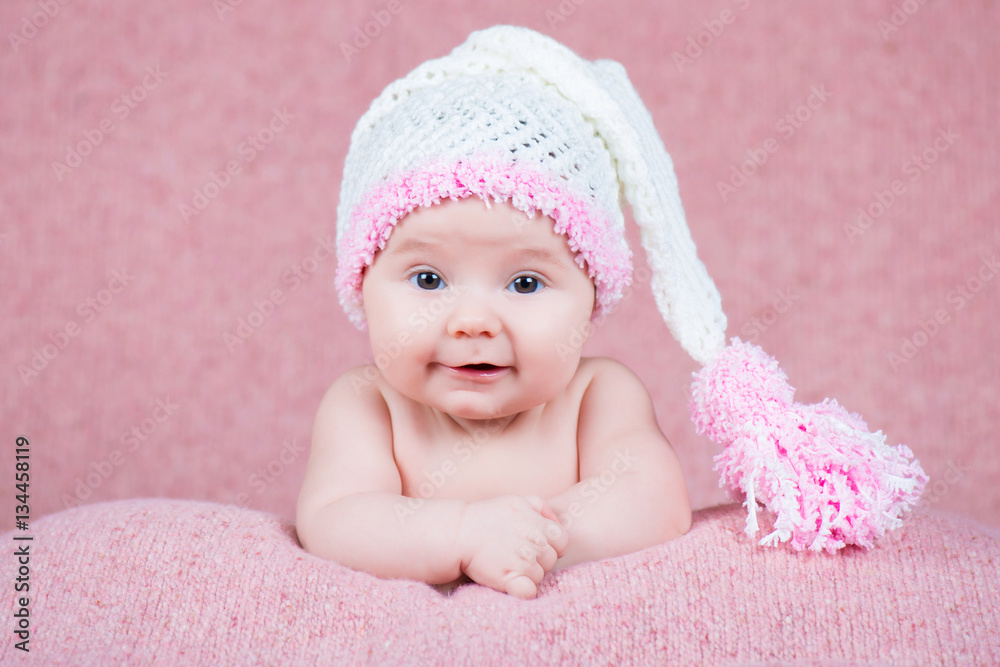 Beautiful little girl in pink warm headphones Beautiful little girl in pink warm headphones