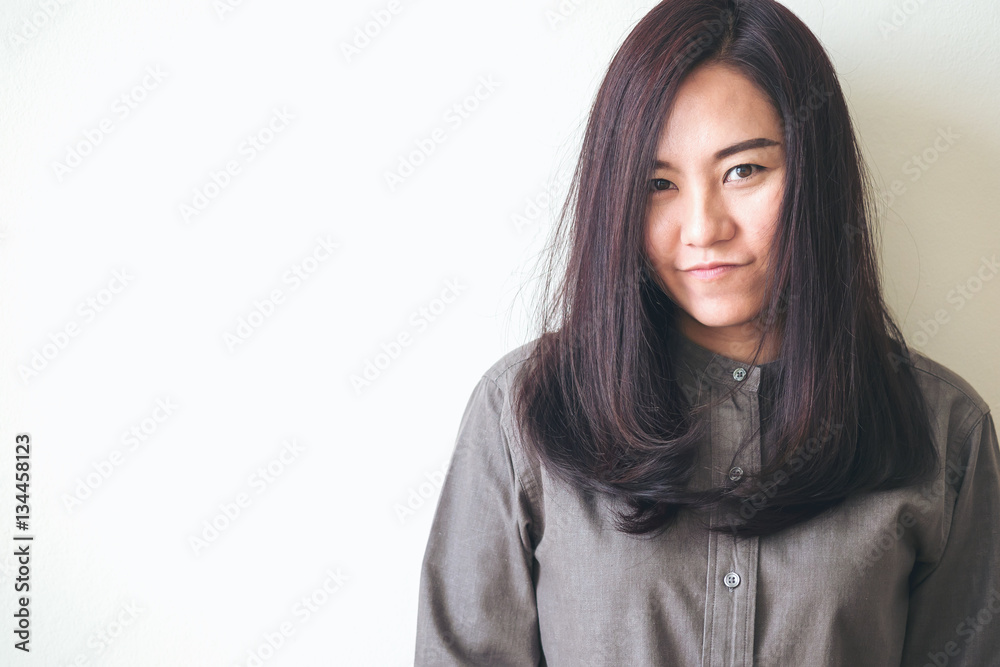 A beautiful asian woman in the white room background A beautiful asian woman in the white room background