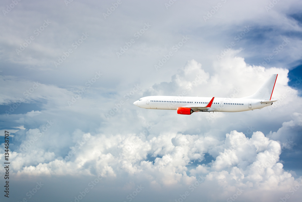 Fototapeta premium Airplane flying above clouds.