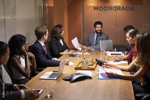 Corporate business people at an evening boardroom meeting © Monkey Business