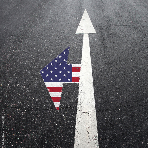 Conceptual relationships and differences with United States of America society and politics. Street arrow signs with Usa flag on intersection choice. © robsonphoto