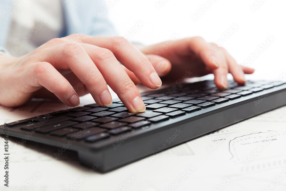 Business woman using computer keyboard