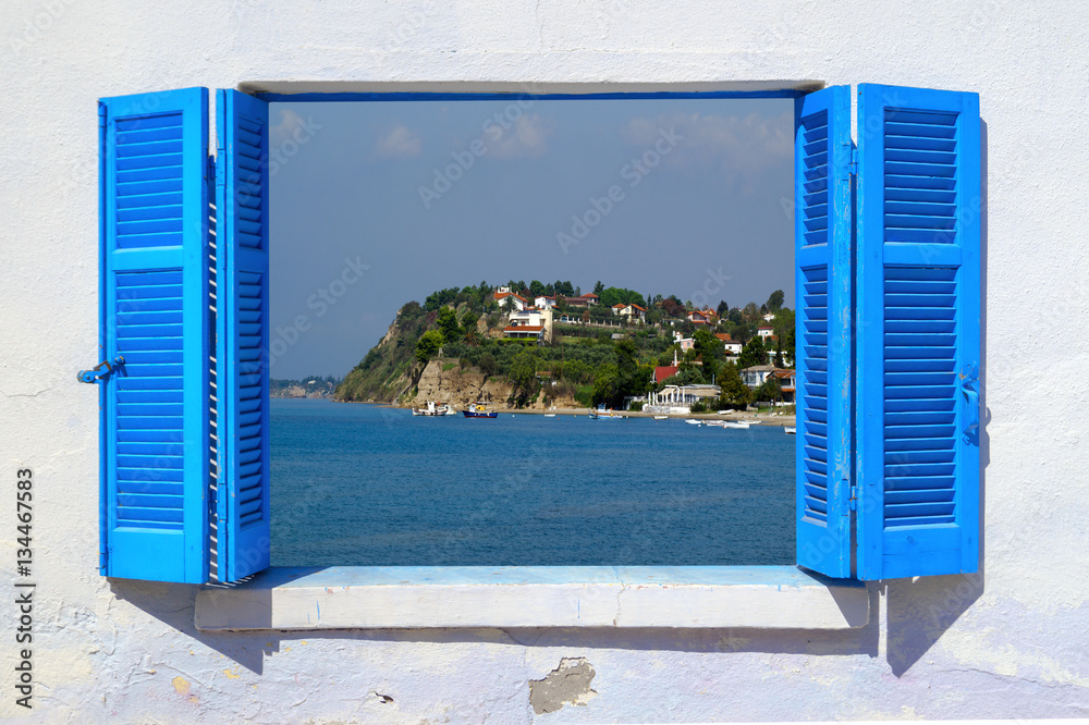 Sea view through traditional greek window
