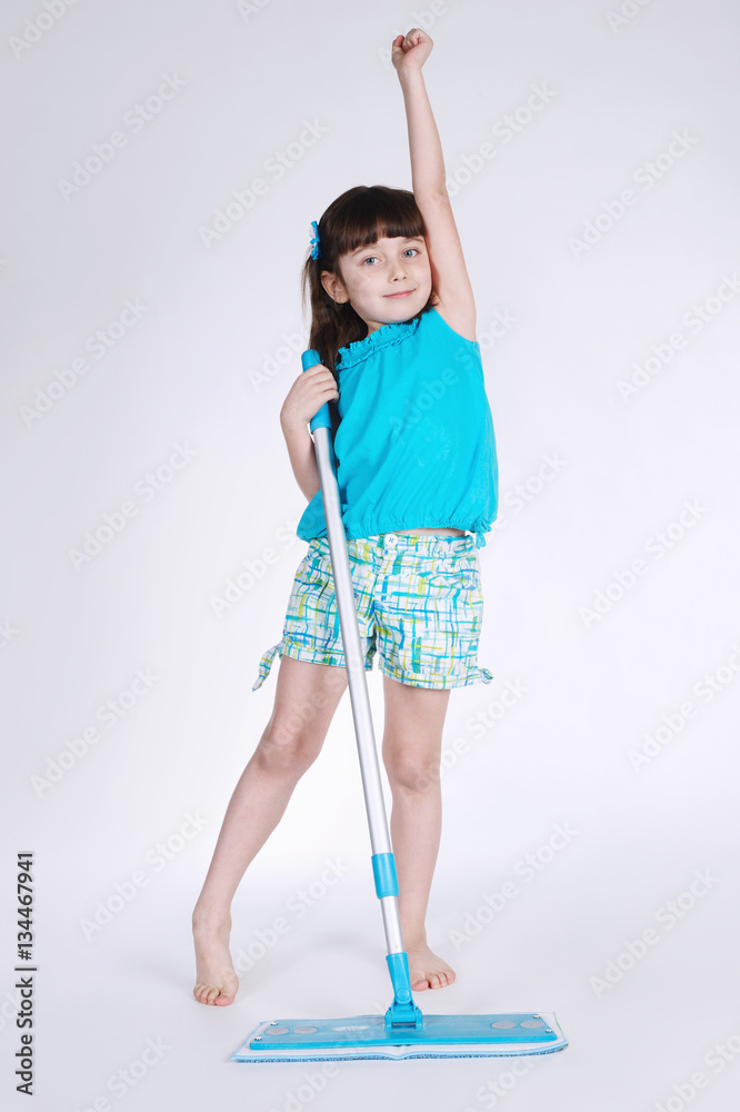 little girl with mop on white