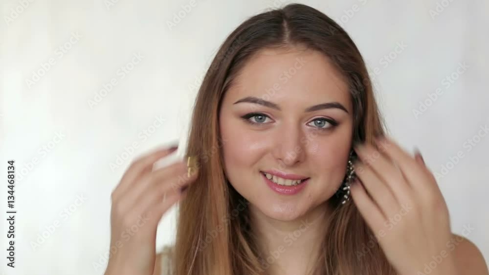 Beautiful girl with long hair looking into the camera. Beautiful girl with long hair looking into the camera.
