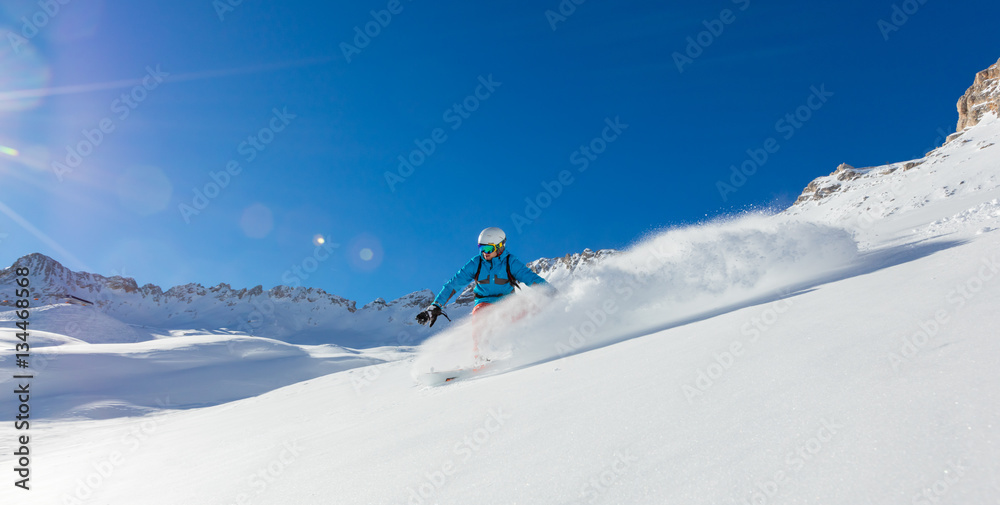Freerider snowboarder running downhill