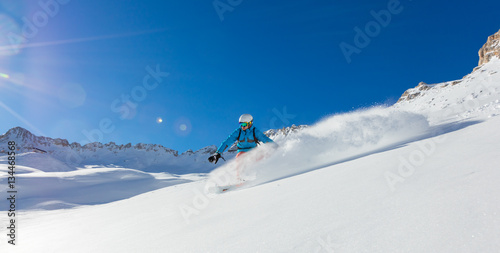 Freerider snowboarder running downhill