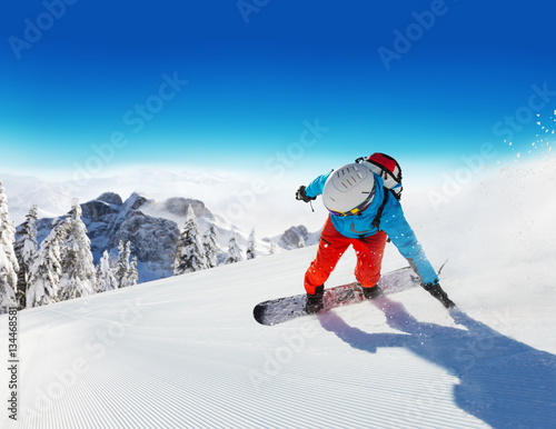 Snowboarder running downhill