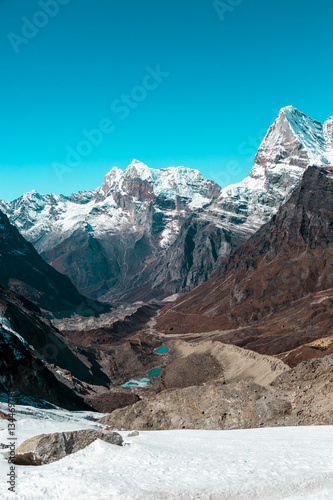 Snowy Glacier and Mountains Valley and Lakes in Himalaya vertical