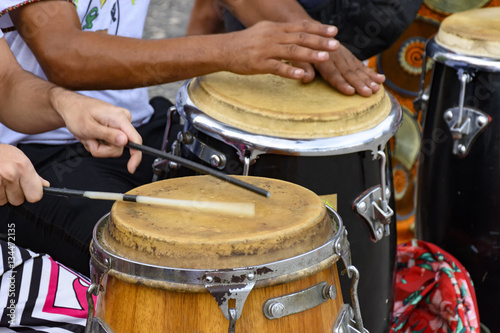 Percussion instrument called atabaque being played in traditional Brazilian party