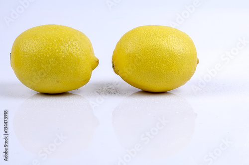 Fresh ripe lemons. Isolated on white background. Top view