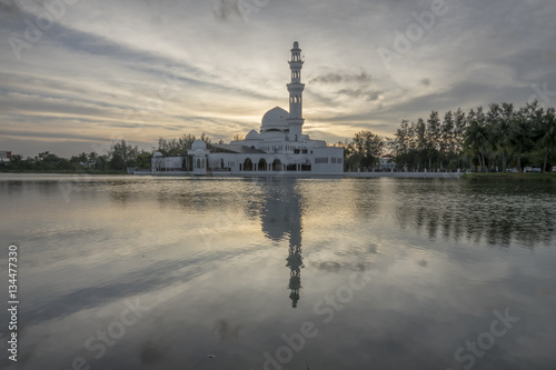 Reflections of Tengku Tengah Zaharah Mosque (floating mosque), Kuala Ibai Terengganu, Malaysia photo