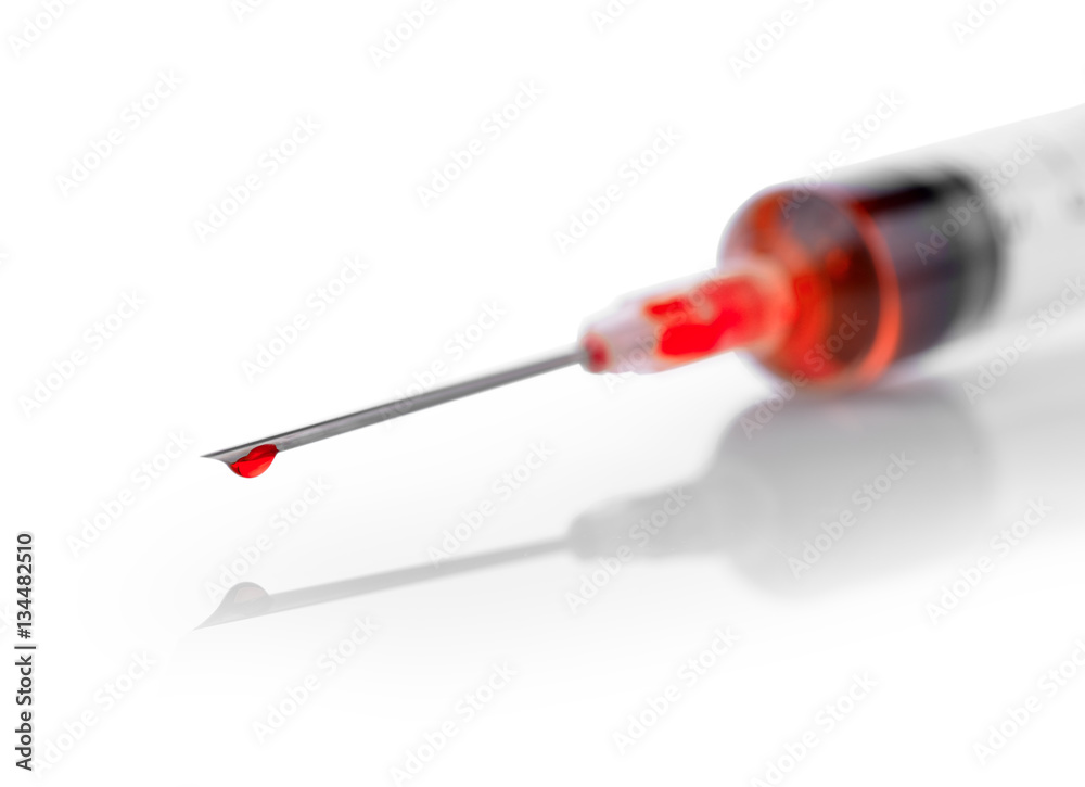 plastic syringe with red liquid isolated on white background plastic syringe with red liquid isolated on white background