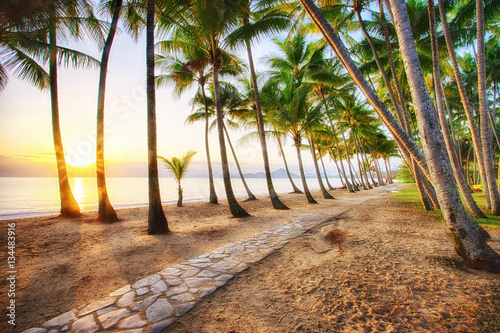 Sunrise over the ocean at Palm Cove in Tropical North Queensland, Australia photo