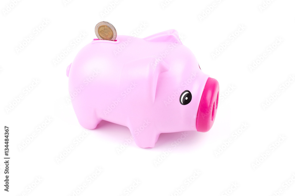 Pink piggy bank isolated on white.
