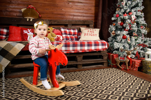 toddler girl in a New Year's interior