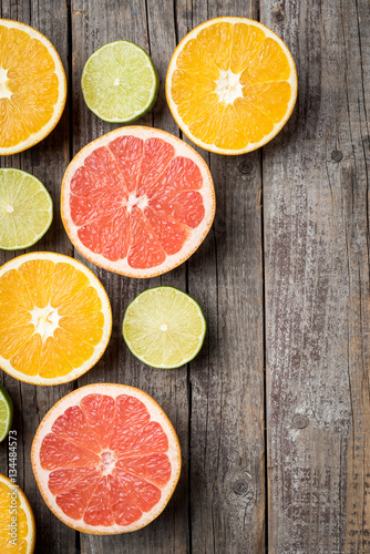 Colorful fruits background with orange, grapefruit and lime halves. Top view © Leszek Czerwonka