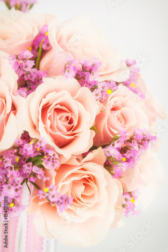 Bouquet of roses and pink statice with photo filter