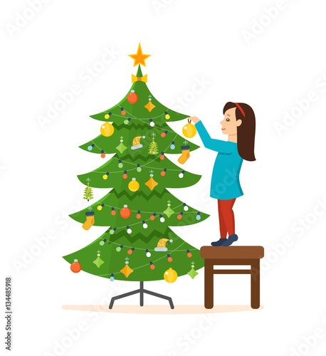 Girl standing on a stool, decorated with New Year Christmas.