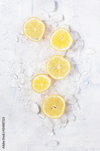 Slices of lemon on the crushed ice © alinakho