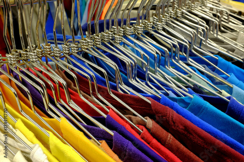 Colored Shirts on Hangers Set on Rack to Sell in Store
