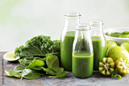 Green juice in glass bottles