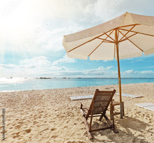 Fototapeta Naklejka Na Ścianę i Meble -  Deck chair by the beach