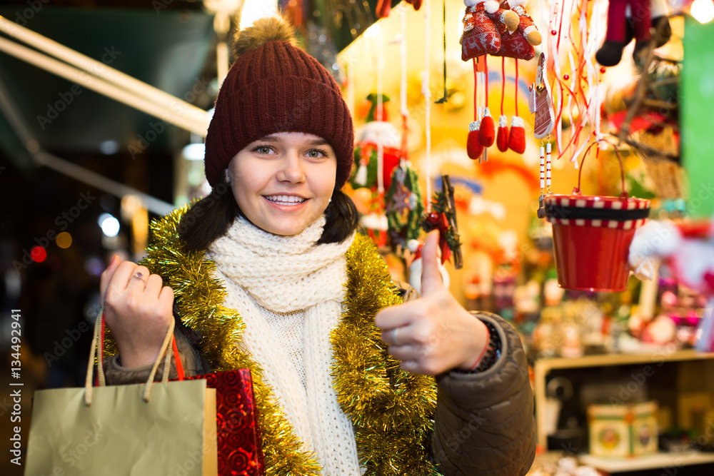 Smiling teen  girl with Christmas garlands