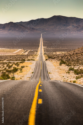 Endless straight road in Death Valley National Park, California, USA