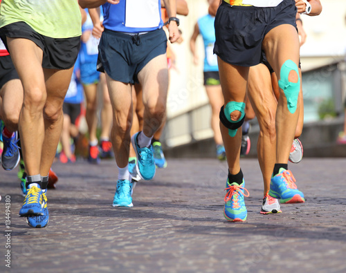 people run fast during sports race through the streets of the ci